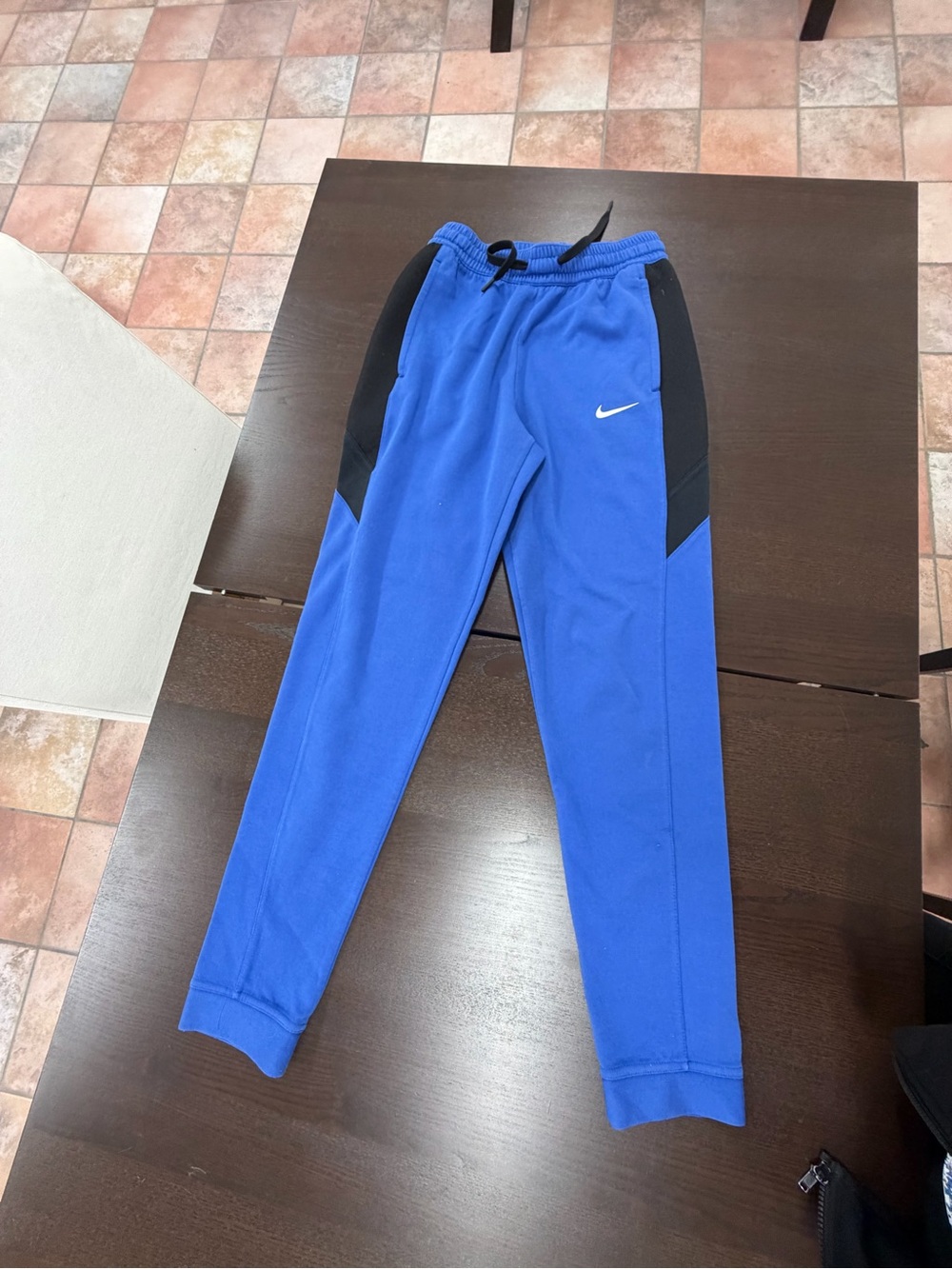 One pair of small Nike sweatpants
